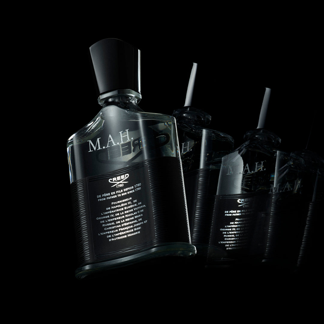 Engraved Aventus fragrance bottles in a luxurious gift box with a ribbon