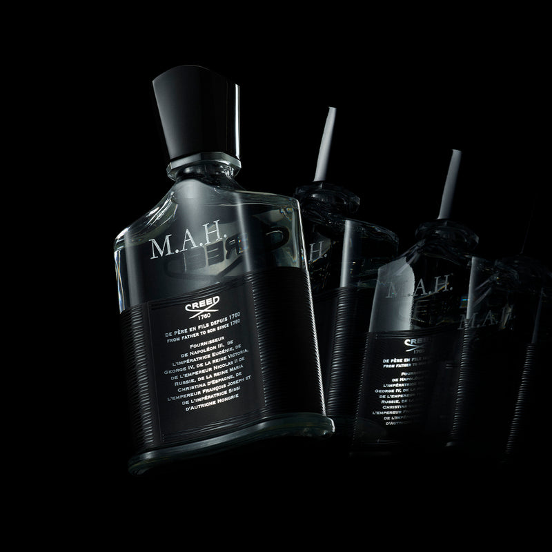 Engraved Aventus fragrance bottles in a luxurious gift box with a ribbon