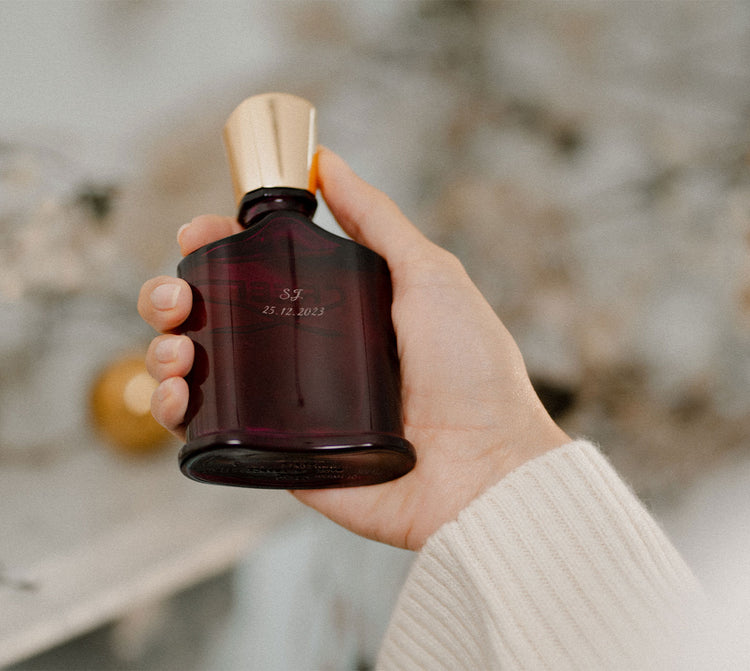 Holding Engraved Bottle of Carmina Holding Engraved Bottle of Carmina