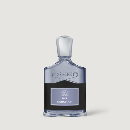 Iris Debonair Creed Debonair Iris perfume bottle, featuring a clear glass body with a black label and a silver-toned cap, set against a solid light gray background.