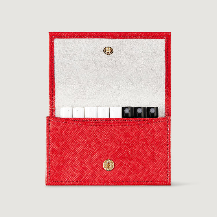 Red leather sample wallet open to show tops of samples