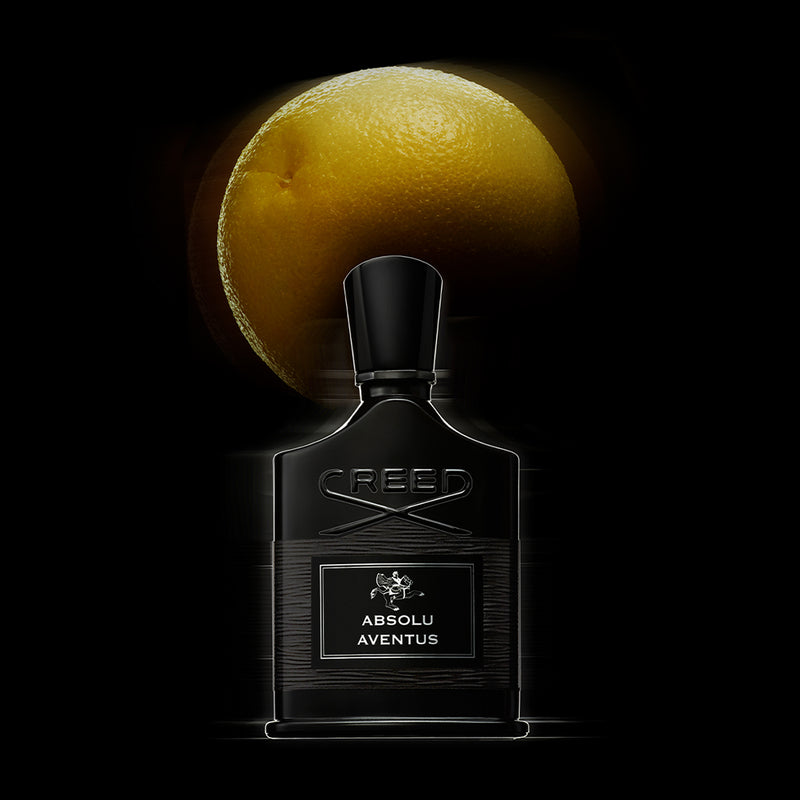 Absolu Aventus with Grapefruit in the background 
