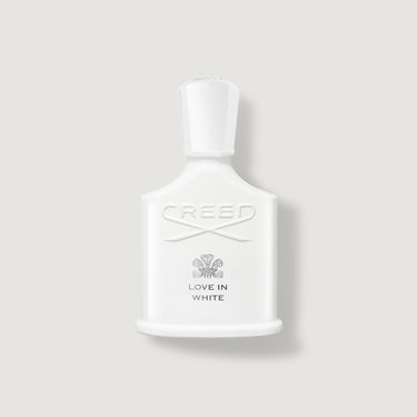 Creed Love in White perfume bottle on a light gray background