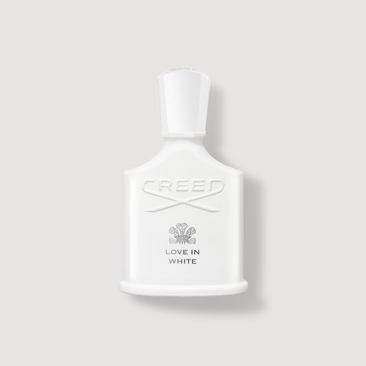 Creed Love in White perfume bottle on a light gray background