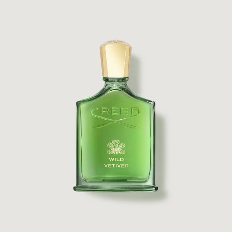 Green Creed Wild Vetiver perfume bottle on a light gray background
