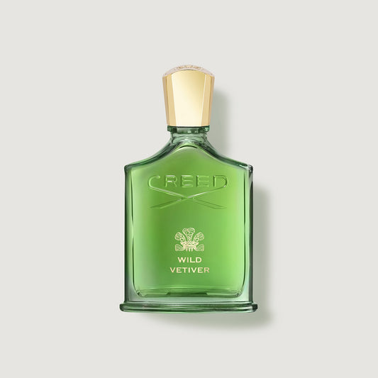 Green Creed Wild Vetiver perfume bottle on a light gray background