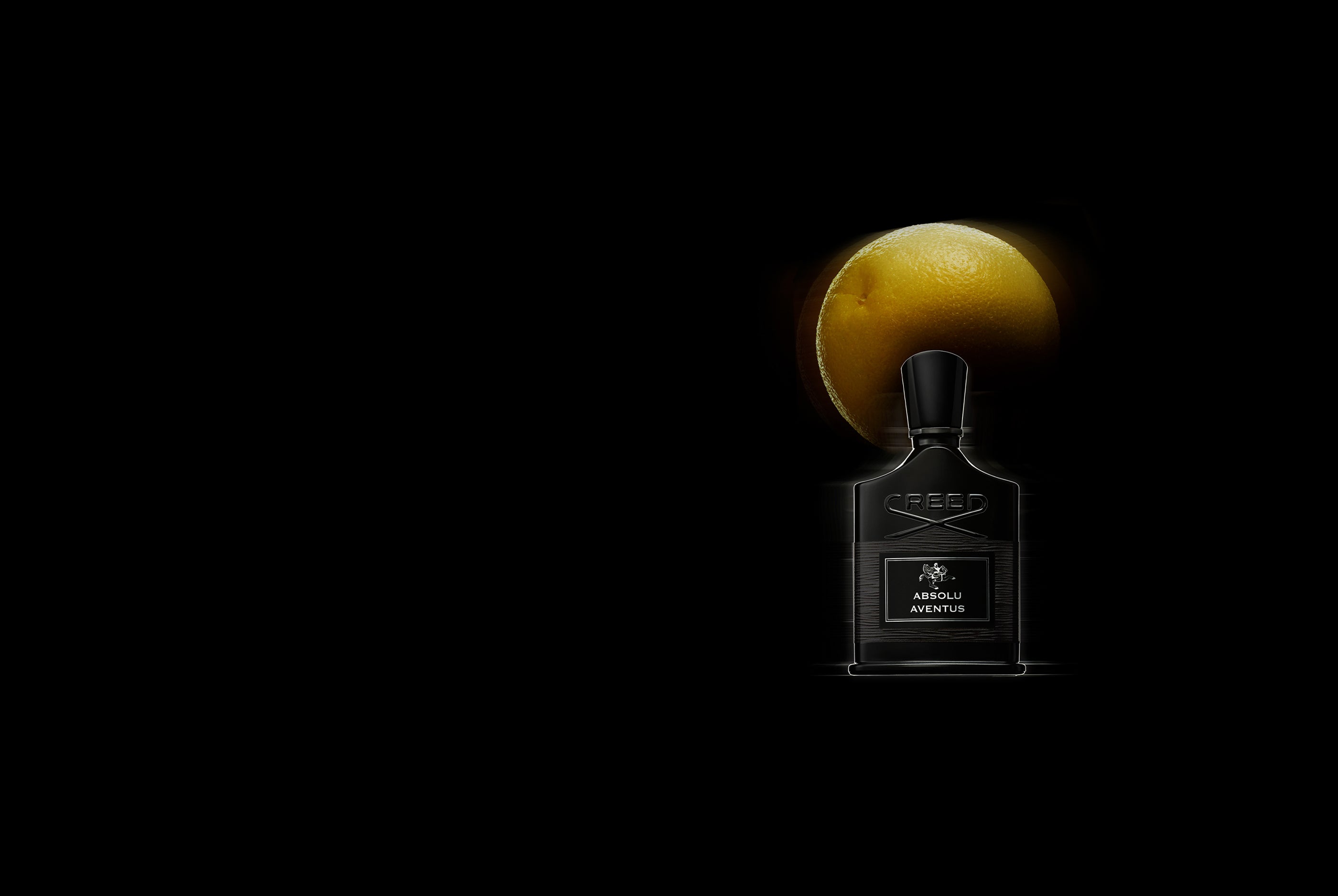 Absolu Aventus with Grapefruit in the background 