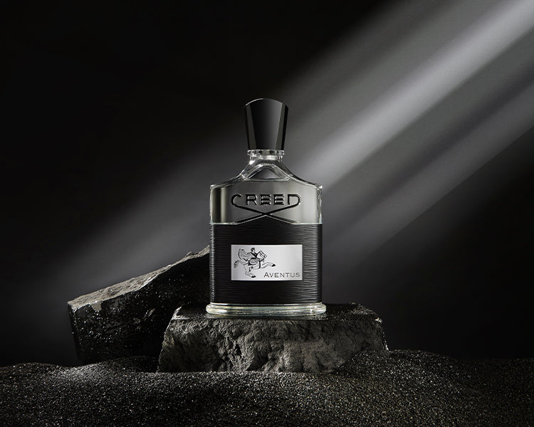 Aventus 100ml bottle with a moon rock and black background