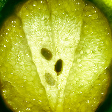 Close-up of a lime with visible seeds and texture