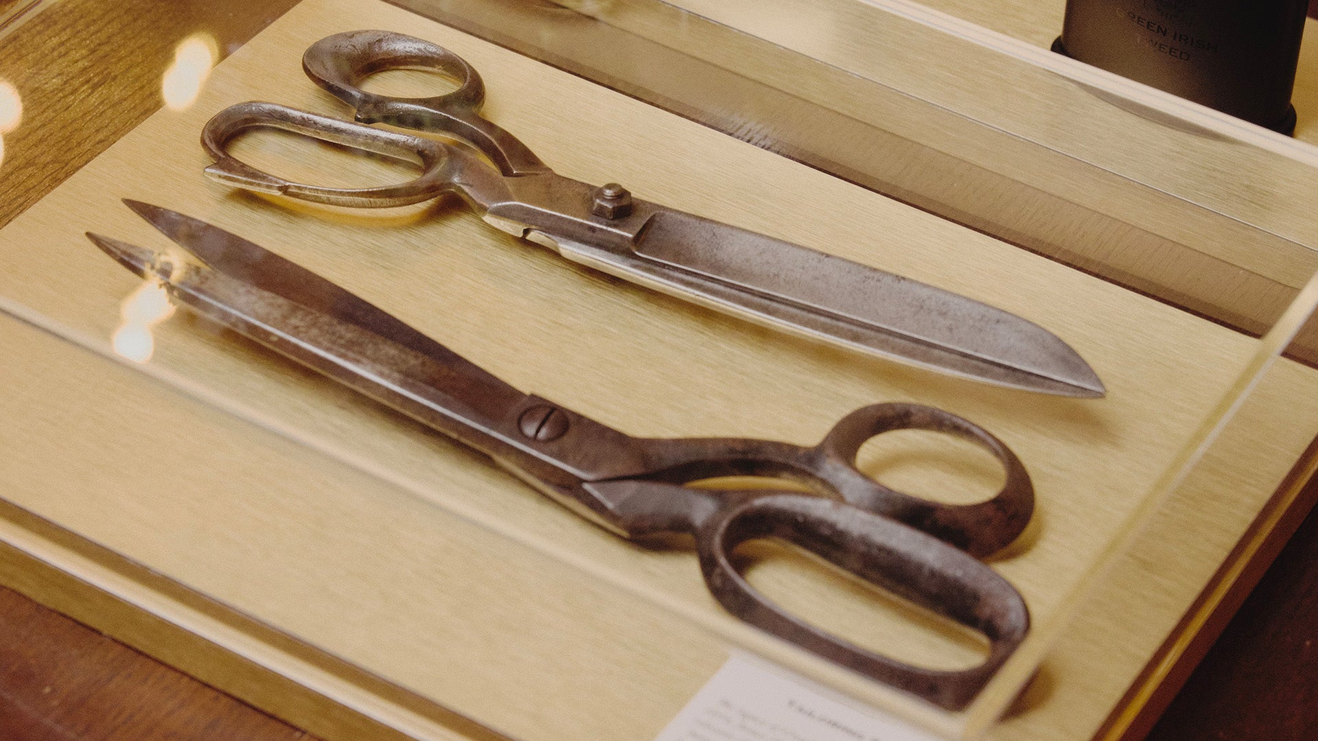 Pair of vintage scissors on a wooden surface
