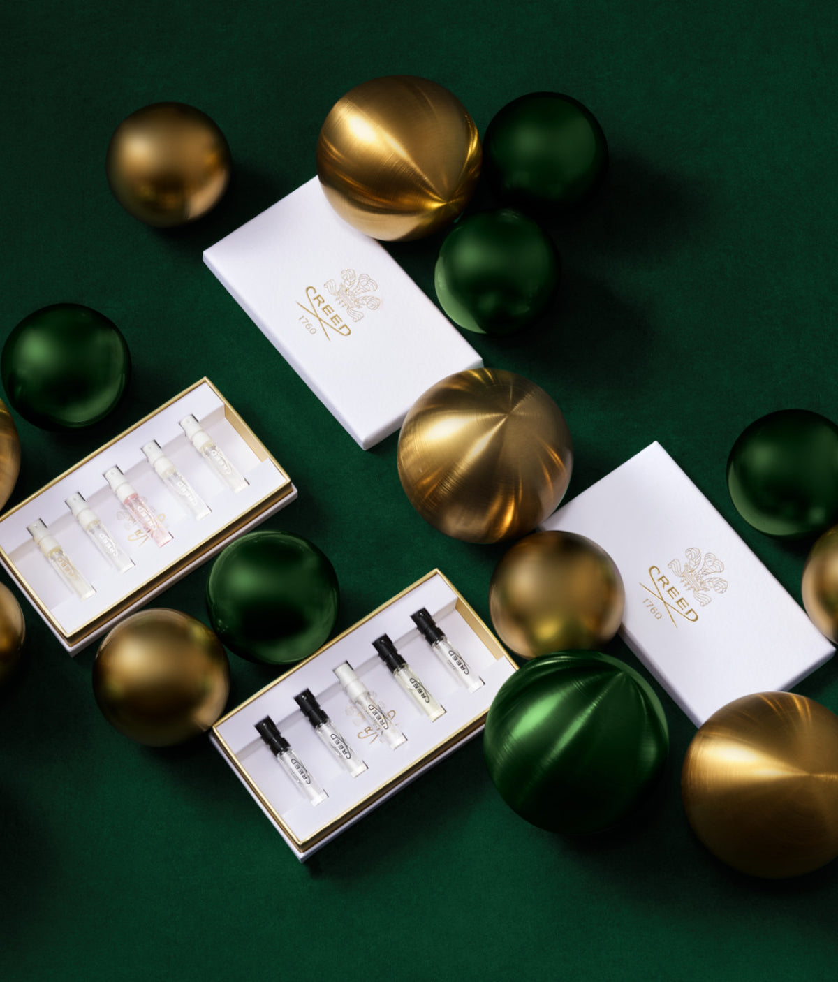 Opened Discovery Gift Boxes featuring gold and green ornaments.