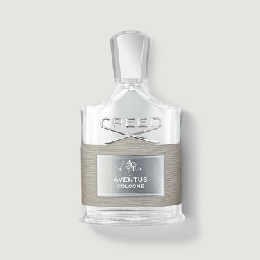Creed Aventus cologne bottle on a light gray background