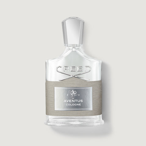 Creed Aventus cologne bottle on a light gray background