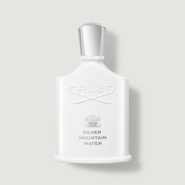 White Creed Silver Mountain Water perfume bottle on a light gray background
